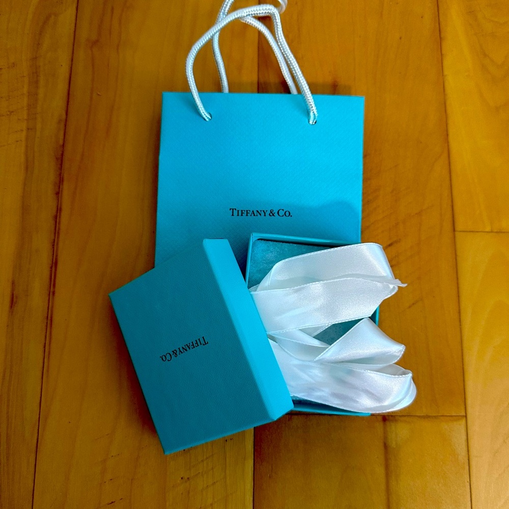 Tiffany & Co. a gift box, ribbon and a bag